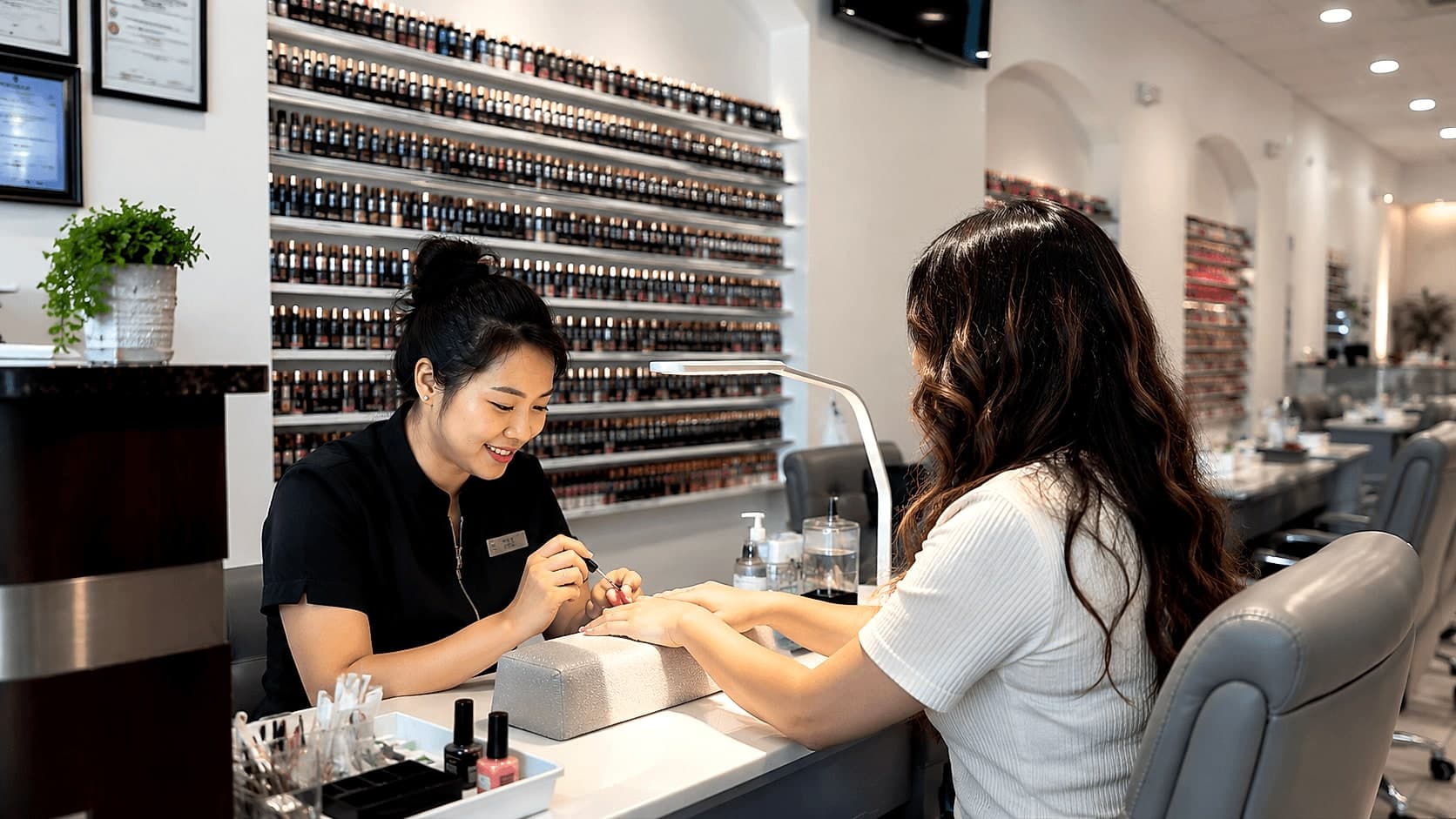 Golden Nails technician doing a manicure for a client in Alabaster, AL